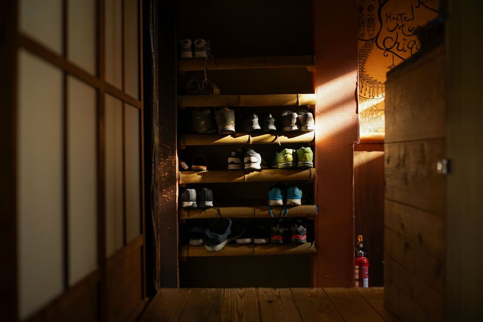 Luxurious walk-in closet featuring a dedicated organized shoe rack